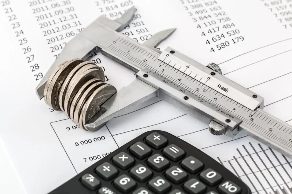 Callipers measuring the height of coins