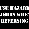 USE HAZARD LIGHTS WHEN REVERSING Stencil